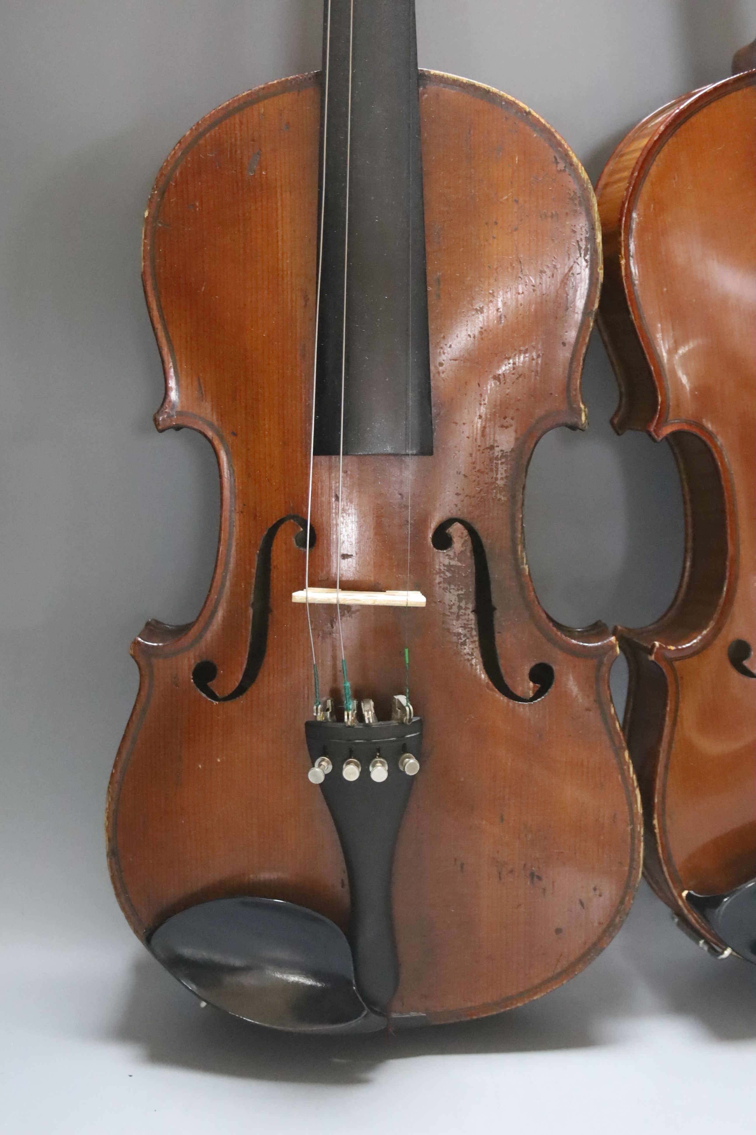 An early 20th century French vioilin, cased with bow and a cased saxon violin